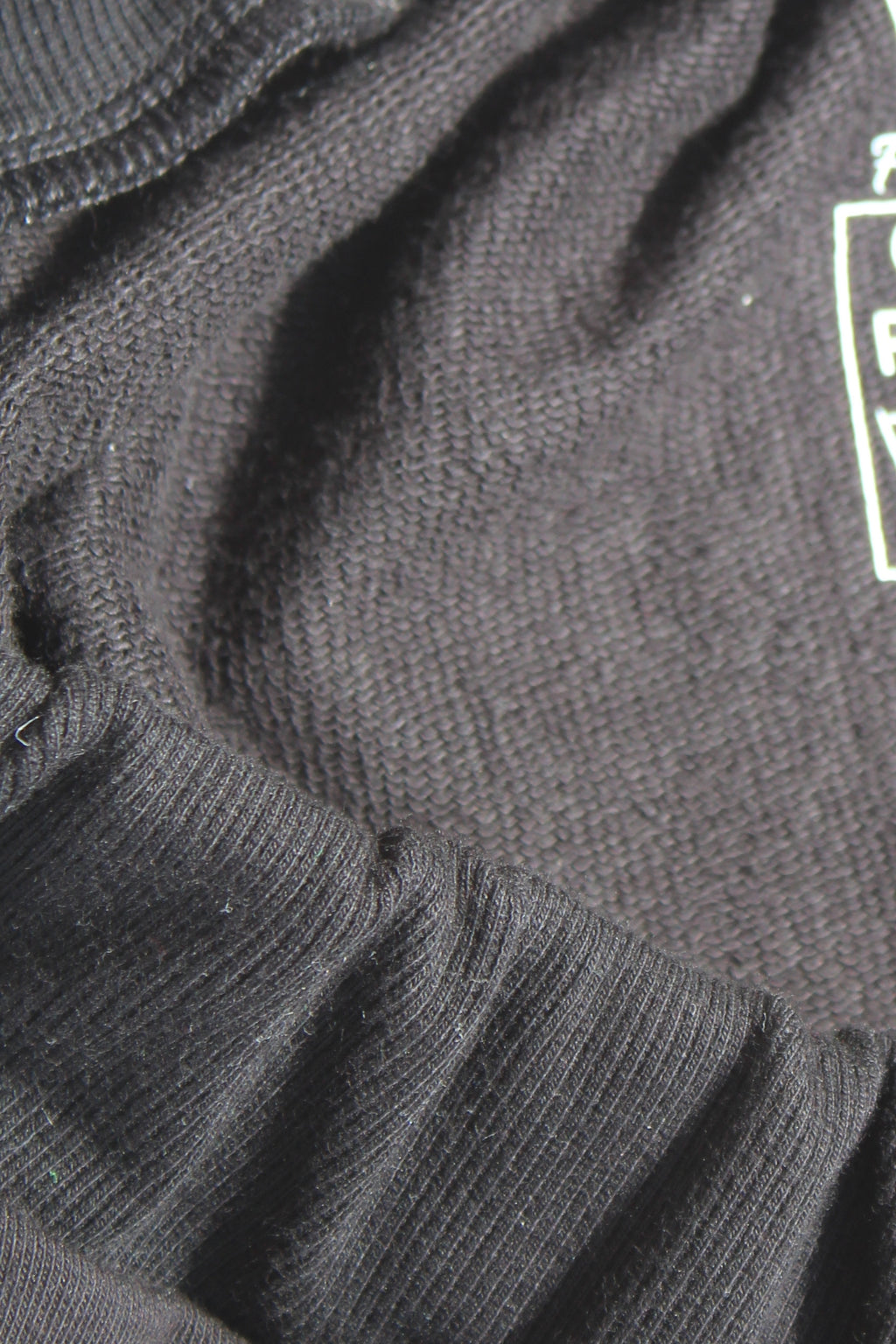 Close-up of French Terry fabric used in Vilber's adaptive joggers, showing the soft three-thread knit texture. 90% cotton, 10% polyester.