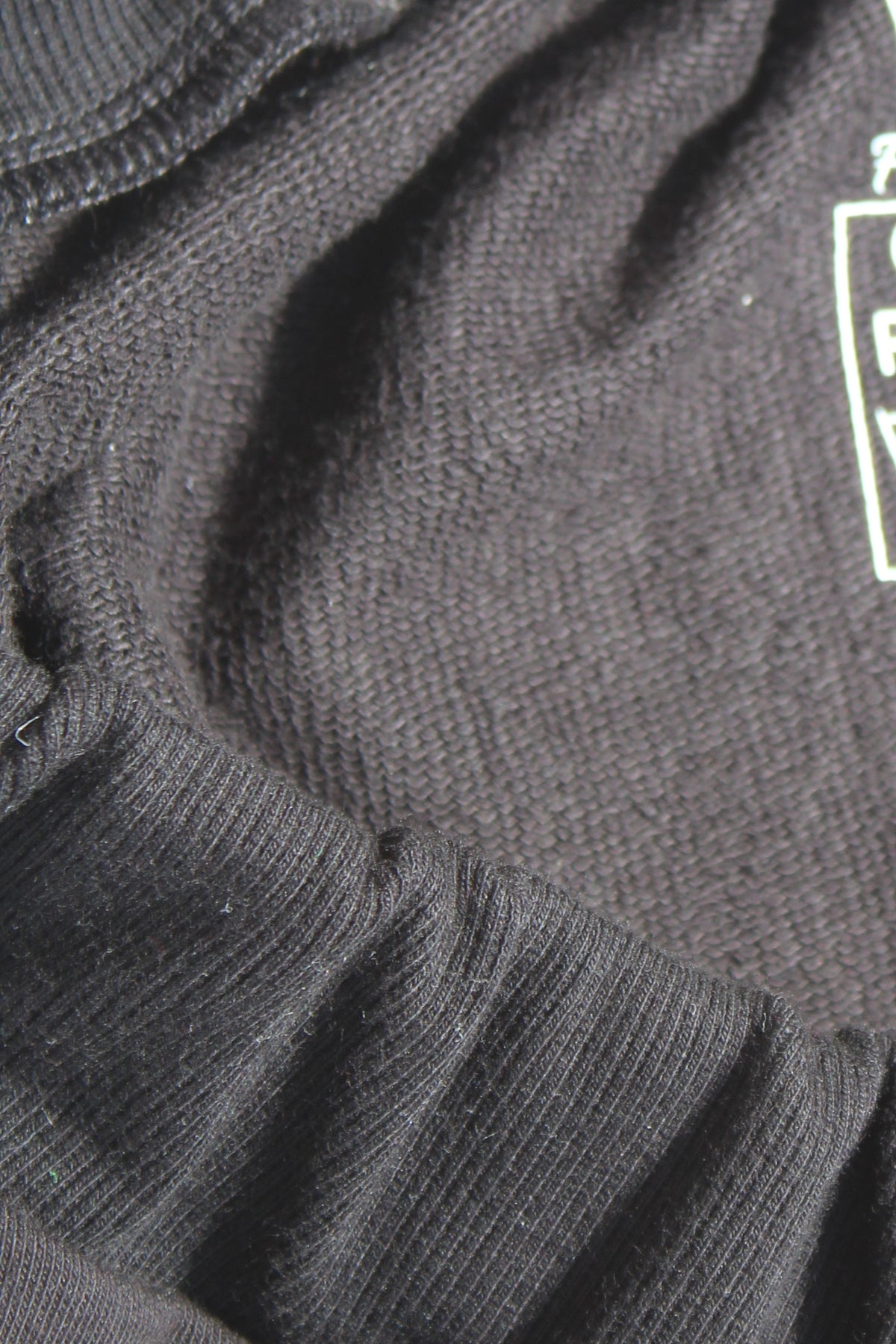Close-up of French Terry fabric used in Vilber's adaptive joggers, showing the soft three-thread knit texture. 90% cotton, 10% polyester.