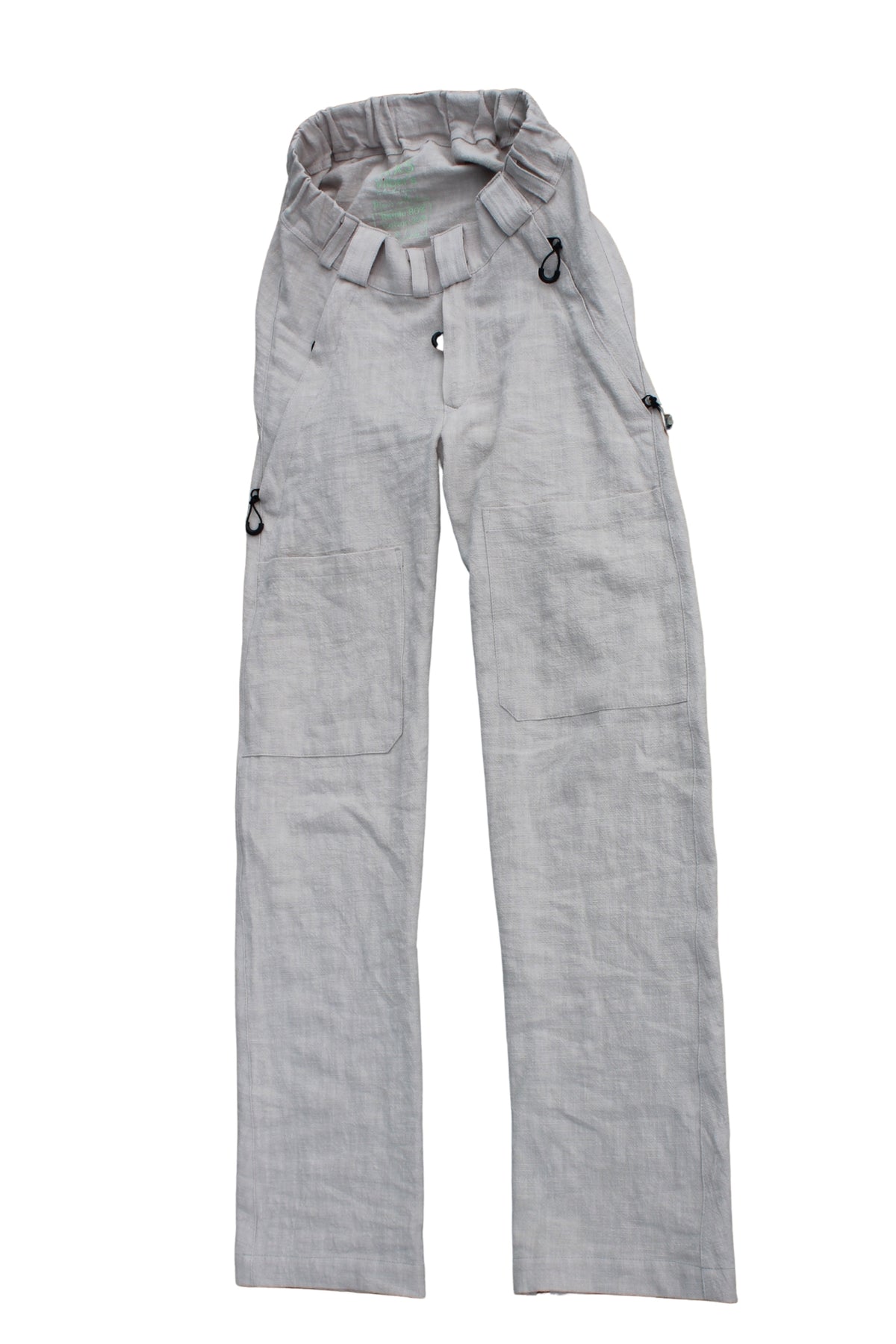 Vilber's men's summer trousers in beige ramie fabric, laid flat showing elasticated waistband and front opening.