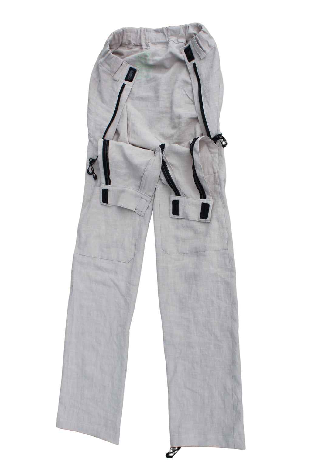 Close view of Vilber's adaptive trousers showing the hidden front access panel with magnetic hook-and-hook closure and zip, disguised as a pocket.