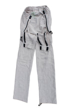 Close view of Vilber's adaptive trousers showing the hidden front access panel with magnetic hook-and-hook closure and zip, disguised as a pocket.