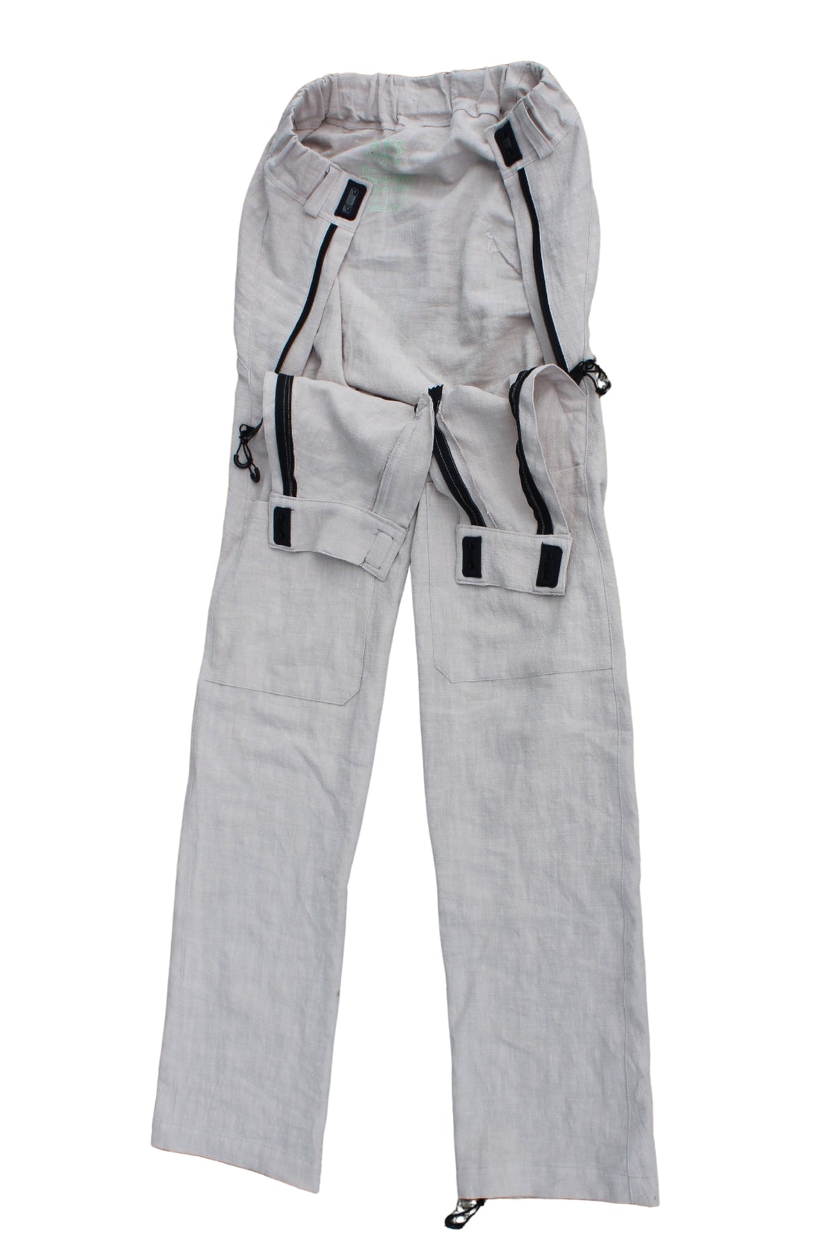 Close view of Vilber's adaptive trousers showing the hidden front access panel with magnetic hook-and-hook closure and zip, disguised as a pocket.
