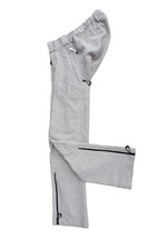 Side view of Vilber's adaptive trousers laid flat, showing the balanced side line and  zip at the inner leg.
