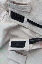 Close-up of the magnetic hook-and-hook closure on Vilber's adaptive trousers, showing how the front access panel aligns and locks into place.