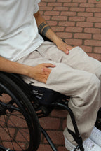 Close-up of the magnetic hook-and-hook closure on Vilber's adaptive trousers, showing how the front access panel aligns and locks into place.