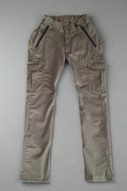 Wheelchair adaptive trousers in khaki colour lying flat on surface, front view