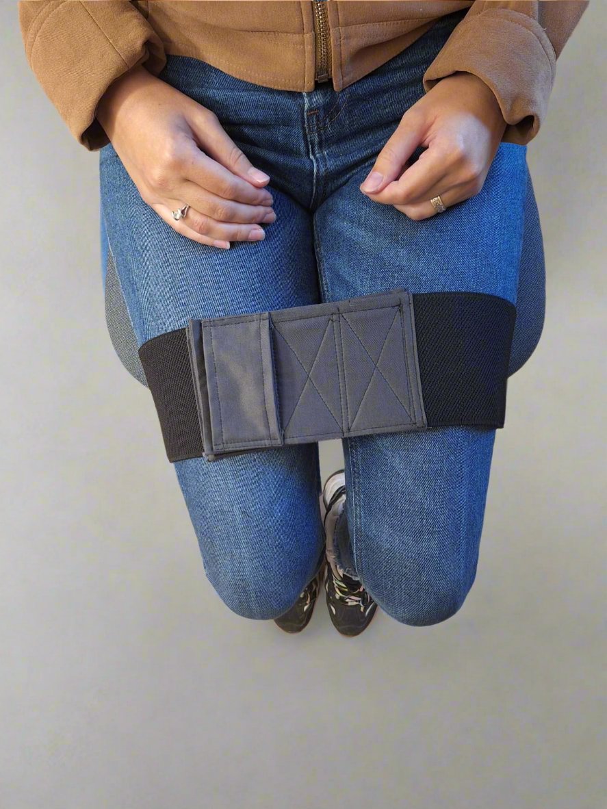 Wide elastic strap for keeping legs together for wheelchair users